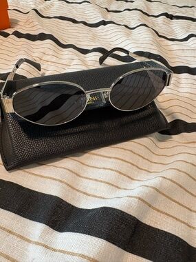 Silver Frame Oval Sunglasses with Black Lenses